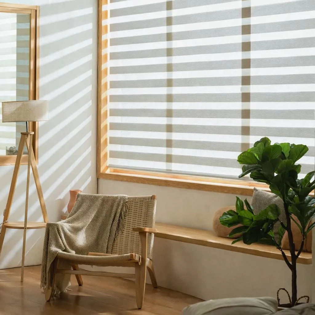 Automated blinds filtering light in a calm living room with voice assistant nearby